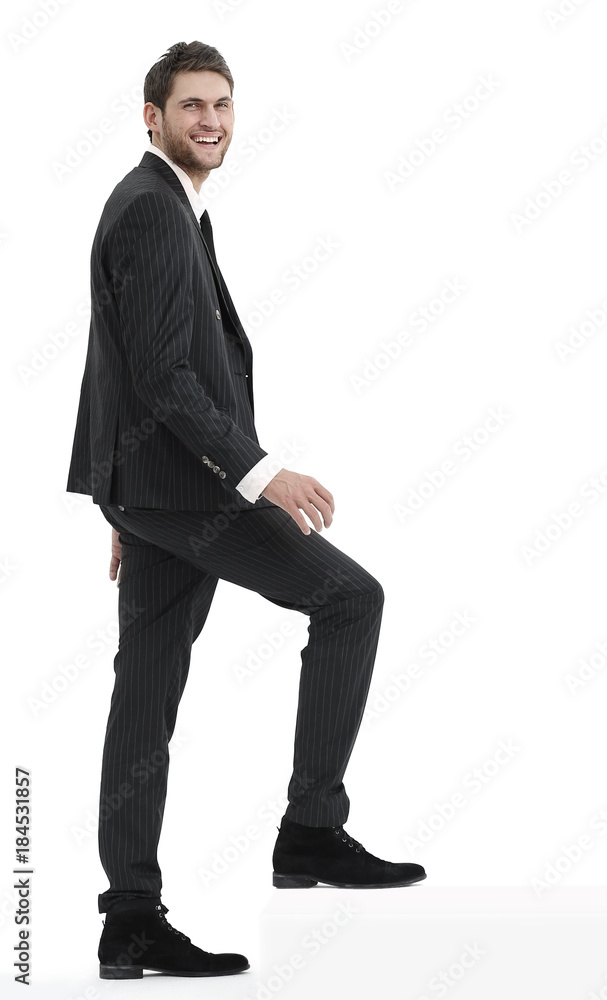 full growth.businessman taking a step forward.isolated on white. full growth.businessman taking a step forward.isolated on white.
