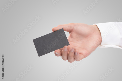 Mockup of white business cards in man's hand
