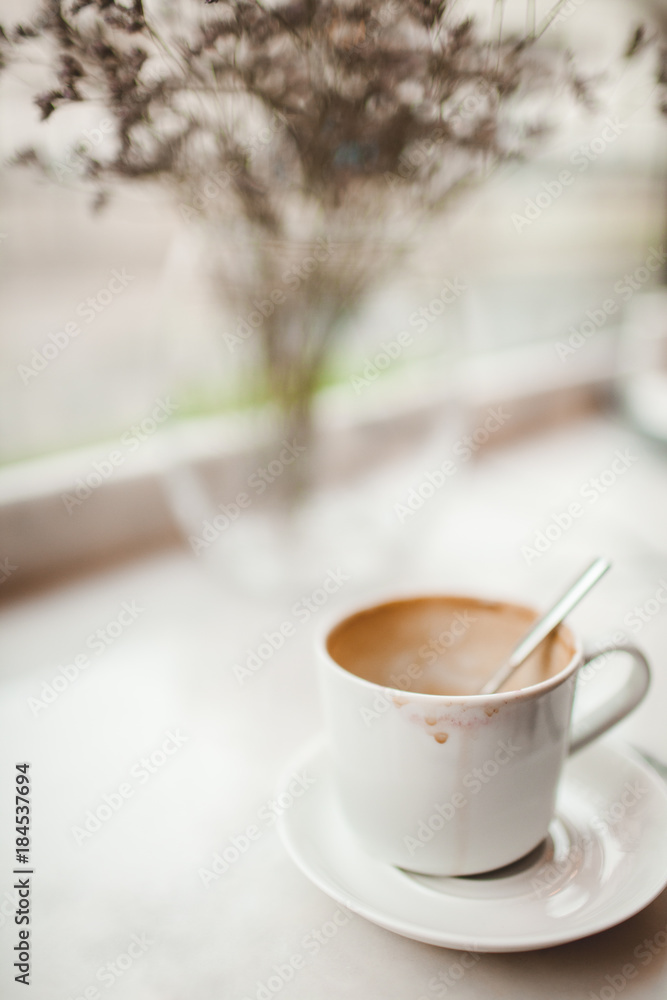 Fototapeta premium White Cup of Drunk Coffee with a Trace of Lipstick