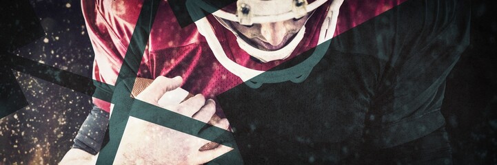 Composite image of american football player protecting football