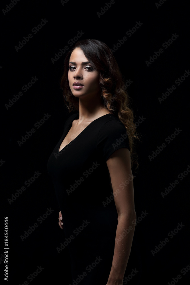 Beautiful woman with evening make-up in black dress Beautiful woman with evening make-up in black dress