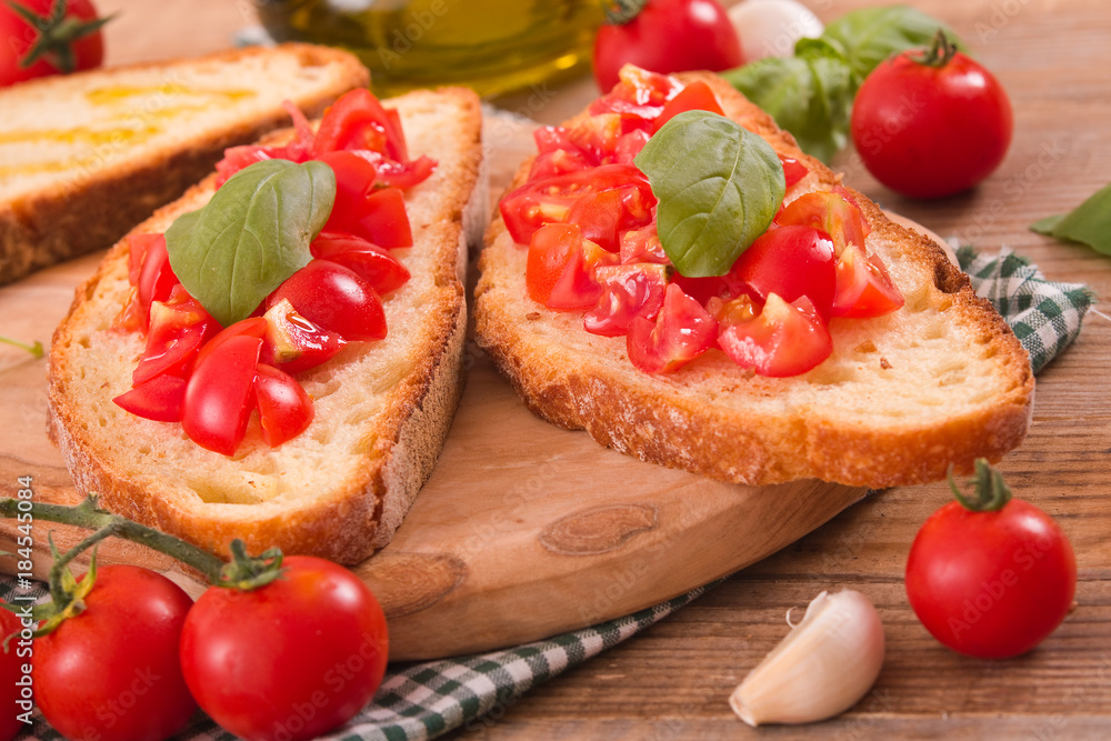 Bruschetta bread with basil and chopped tomatoes. Bruschetta bread with basil and chopped tomatoes.
