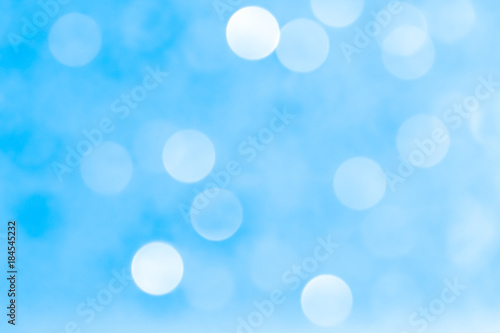 White blue bokeh light abstract background texture. Christmas pattern bokah, wallpaper.
