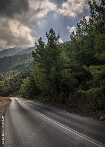 road in the mountain with clowdy sky