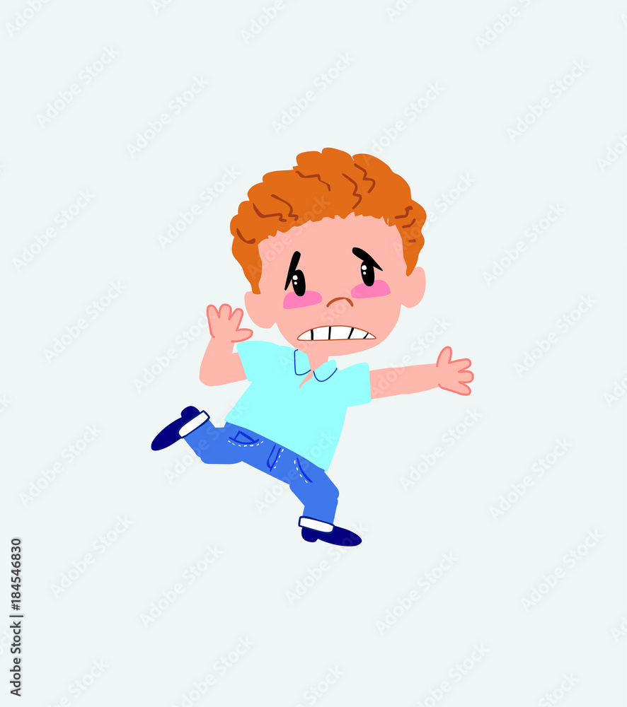 Blond boy in jeans runs alarmed. Blond boy in jeans runs alarmed.
