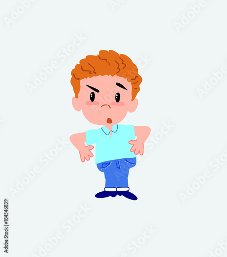 Blond boy in jeans with an expression of unpleasant surprise.
