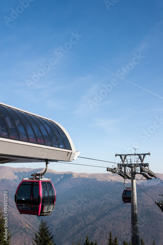 Ski gondolas on a mountain resort in bright sunlight © Tudor Voinea