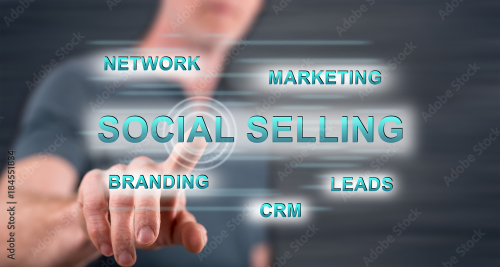 Man touching a social selling concept on a touch screen Man touching a social selling concept on a touch screen