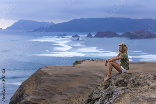 Wallpaper Mural Indonesia, Lombok, woman sitting at the coast looking at view Torontodigital.ca