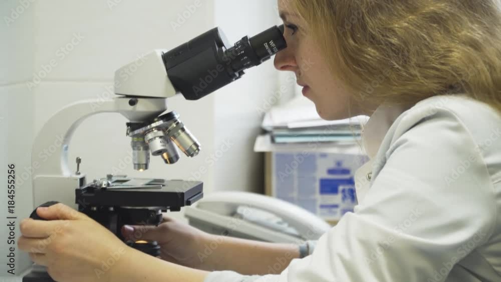 Doctor woman working with a microscope in Laboratory. Female scientist looking through a microscope in lab. Scientist using a microscope in a laboratory. Doctor woman working with a microscope in Laboratory. Female scientist looking through a microscope in lab. Scientist using a microscope in a laboratory.