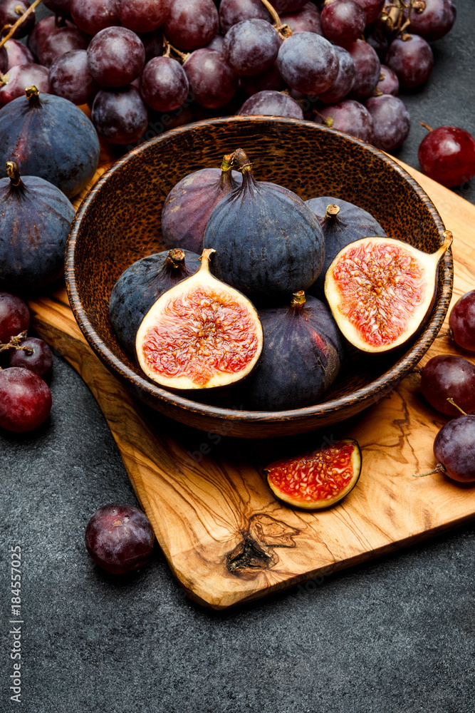 Ripe Grapes and Figs on dark concrete background Ripe Grapes and Figs on dark concrete background
