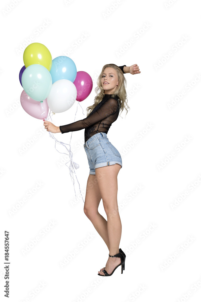 eine fröhliche junge Frau mit einer hand voll luftballons eine fröhliche junge Frau mit einer hand voll luftballons