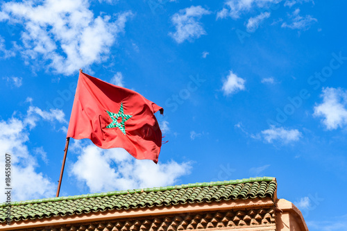 moroccan flag with blue sky at bakcground photo