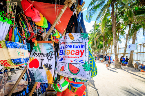 Local souvenir shops - lined white beach in Boracay Island, Philippines photo