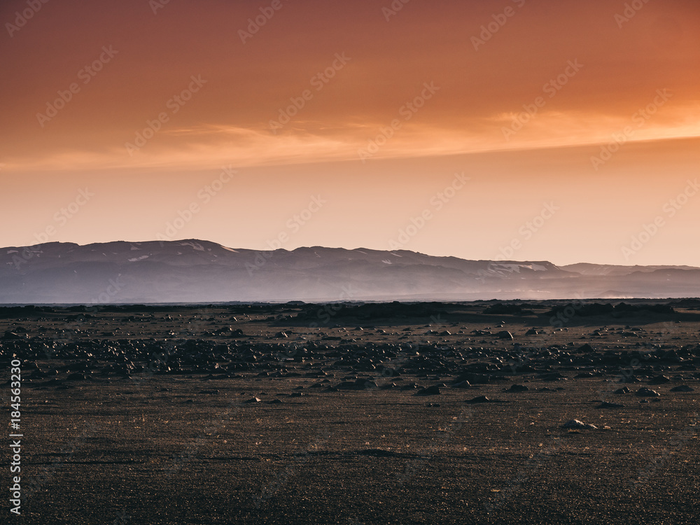 scenery with black sand, rocks and mountains at sunset, Iceland scenery with black sand, rocks and mountains at sunset, Iceland