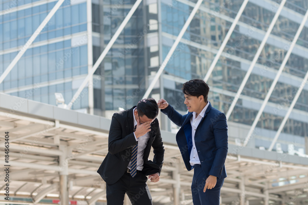 The boss complaining pointing to him for mistake work. Depressed man employee from being reprimanded by the manager. background in big city The boss complaining pointing to him for mistake work. Depressed man employee from being reprimanded by the manager. background in big city