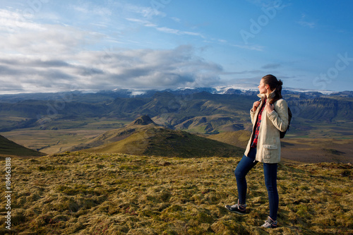 Attractive girl tourist on background of mountain landscape © Ulia Koltyrina
