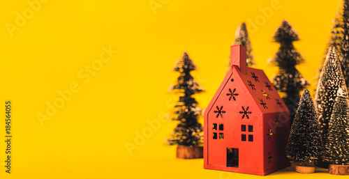 christmas and newyear concept with arrange of decorating items house and treewith free copy space for your creativity ideas text photo