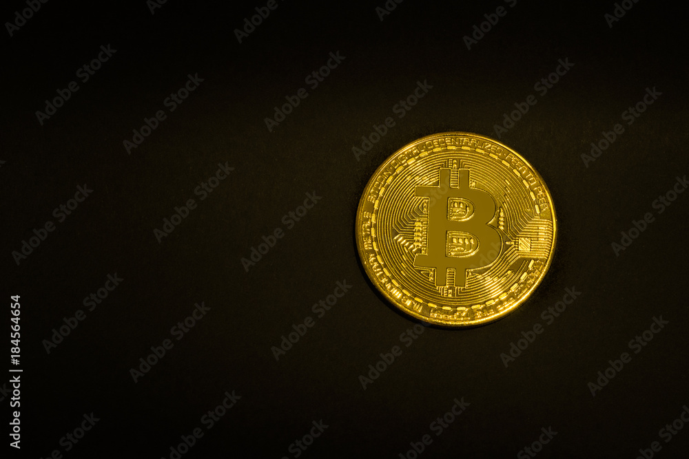 Gold coin Bitcoin on a black background. Isolate. Space for text Gold coin Bitcoin on a black background. Isolate. Space for text