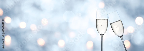 Abstract blue winter background with champagne and bokeh