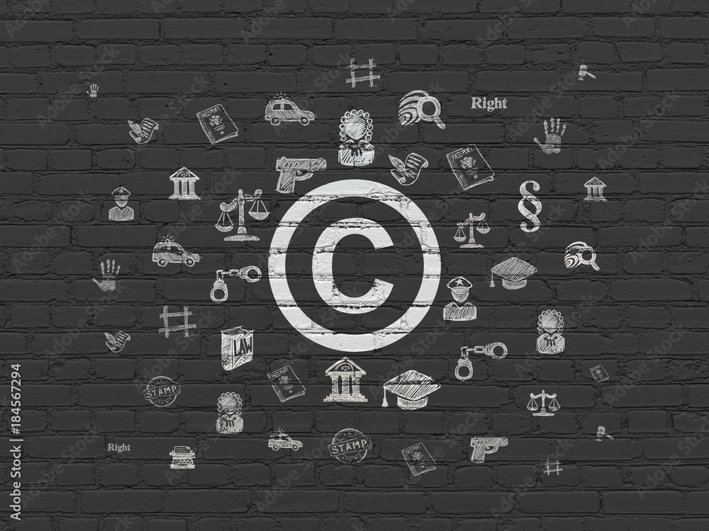 Law concept: Painted white Copyright icon on Black Brick wall ...