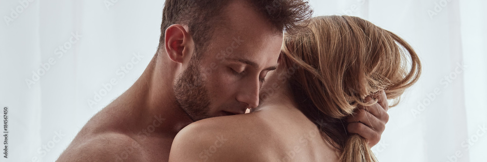 Man kissing woman's collarbone Stock Photo | Adobe Stock