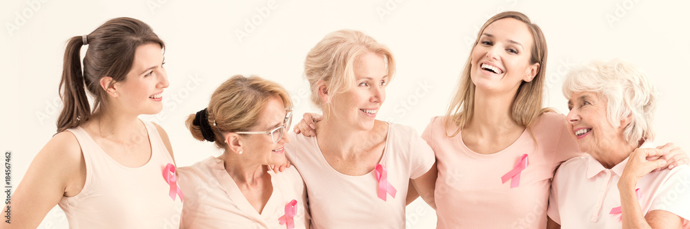 Women hugging and smiling Women hugging and smiling