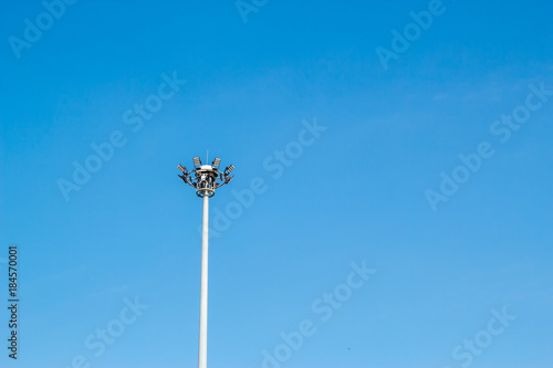 light pole tower in sport arena on blue sky