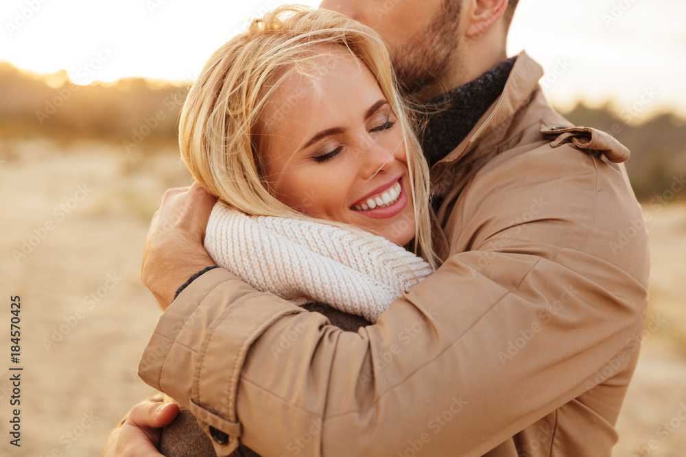 Close up portrait of a beautiful couple in love hugging Close up portrait of a beautiful couple in love hugging