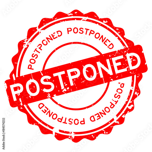 Grunge red postponed word round rubber seal stamp on white background
