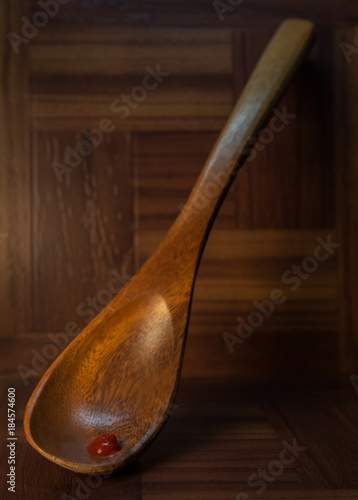 wood spoon with chili sauce