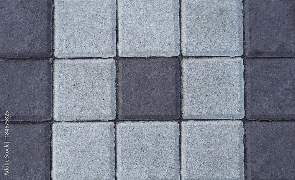 Naklejka premium Stone paving tiles of different shapes and colors
