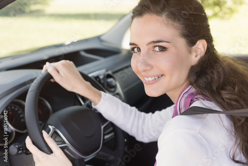 Young woman driving her car © StockPhotoPro