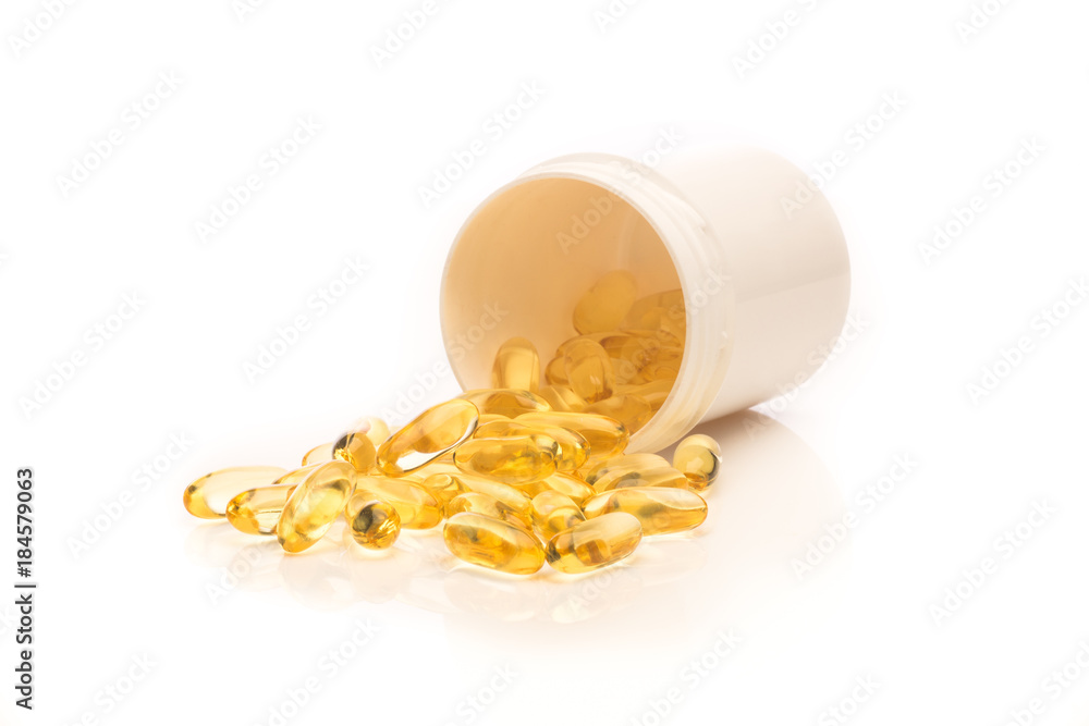transparant pills spilling out of a box, isolated on a white background transparant pills spilling out of a box, isolated on a white background