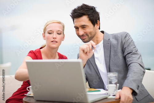 Couple in front of laptop