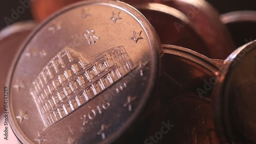 Centesimi di euro in lenta rotazione. Dettaglio monete photo