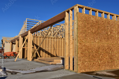 Wood frame apartment building under construction.