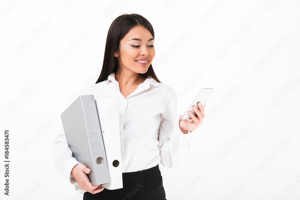 Portrait of a smiling asian businesswoman holding binders Portrait of a smiling asian businesswoman holding binders