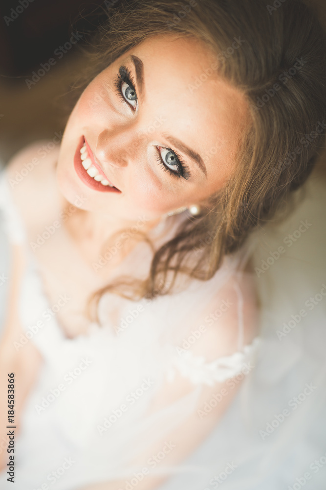 Portrait of beautiful bride with fashion veil at wedding morning Portrait of beautiful bride with fashion veil at wedding morning
