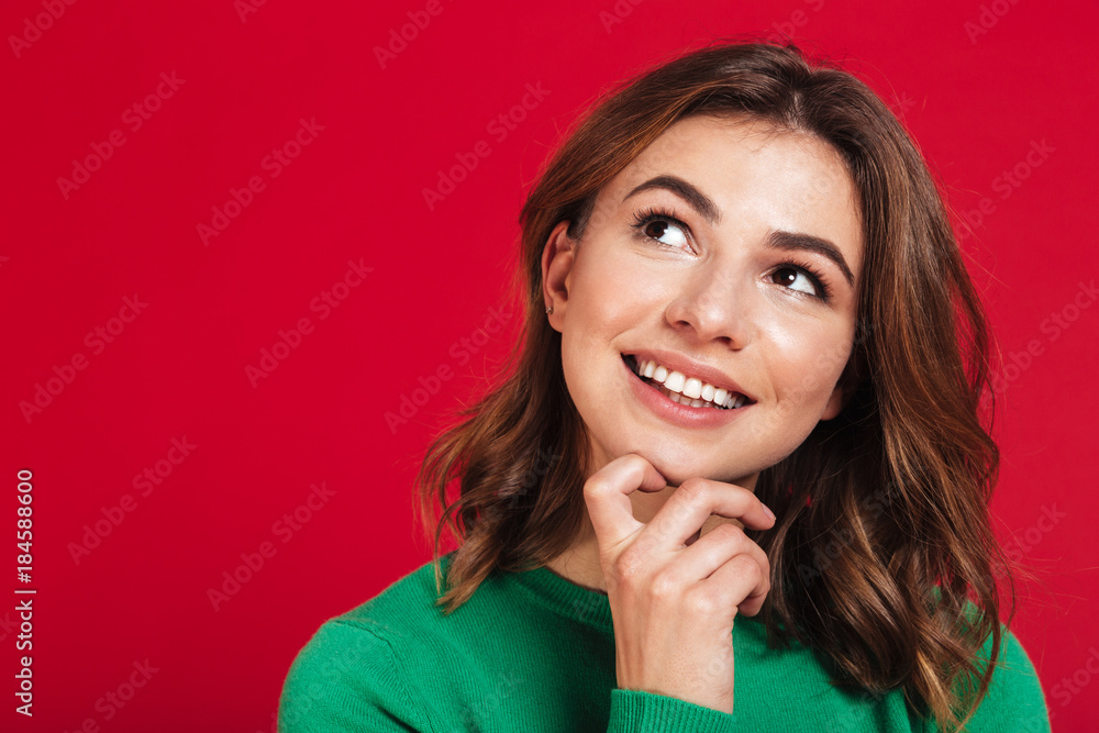 Smiling dreaming young pretty woman standing isolated Smiling dreaming young pretty woman standing isolated