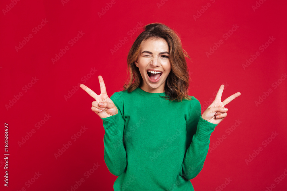 Happy young pretty woman showing peace gesture. Happy young pretty woman showing peace gesture.
