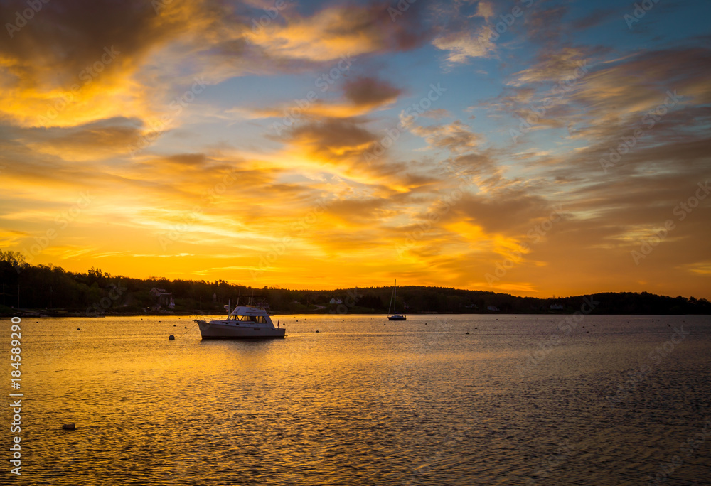 sunrise over a fishing boat
