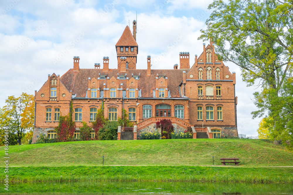 Old red castle with orange roof at Latvia. Old red castle with orange roof at Latvia.