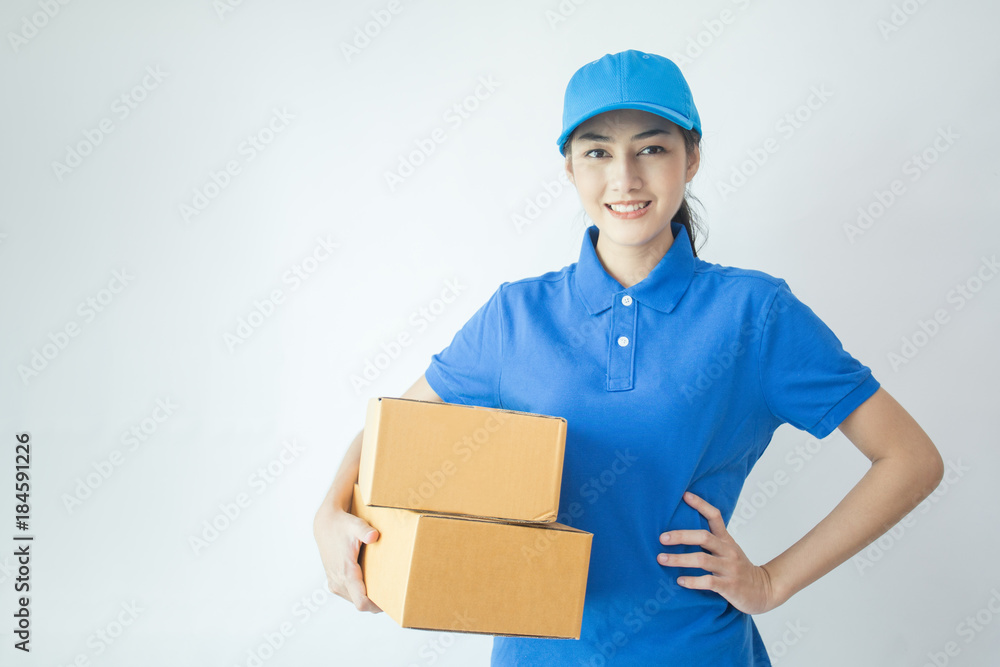 Young Asian Woman with Delivery service worker in uniform. Woman holding Box with attractive smiling isolated on white background. Young Asian Woman with Delivery service worker in uniform. Woman holding Box with attractive smiling isolated on white background.
