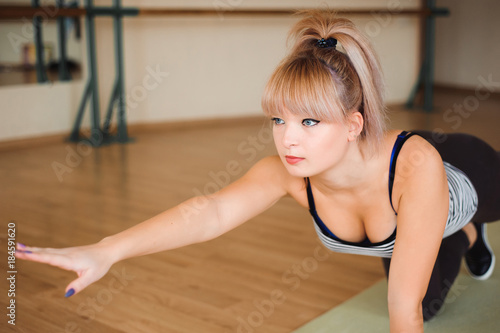 Fitness, sport, exercising lifestyle - Happy women wear in bodysuits doing exercises at gym