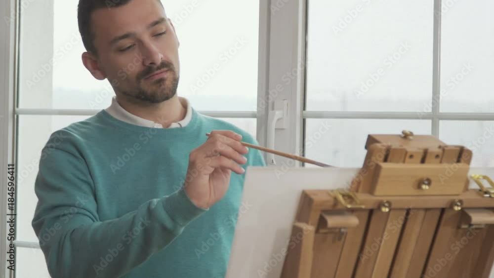 Handsome guy draws picture Handsome guy draws picture