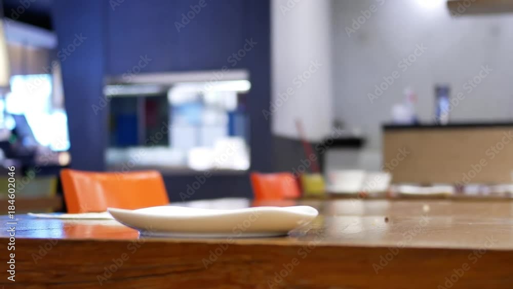 Pan shot of worker cleaning table after customer eating food inside restaurant with 4k resolution. Pan shot of worker cleaning table after customer eating food inside restaurant with 4k resolution.