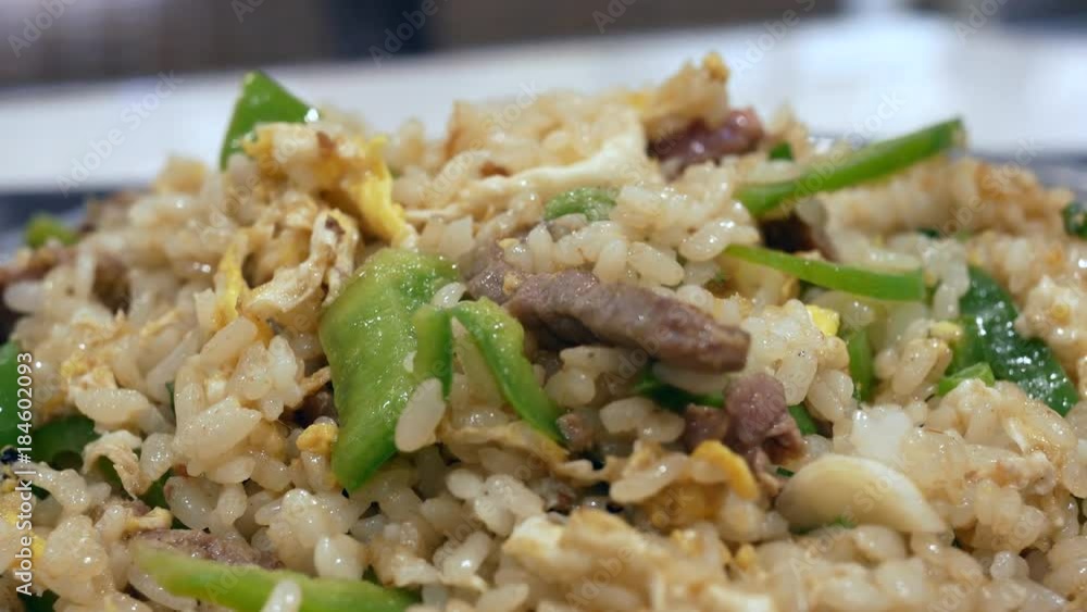 Motion of fried rice on table inside restaurant with 4k resolution. Motion of fried rice on table inside restaurant with 4k resolution.