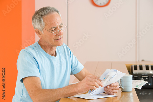 A man opening his mail