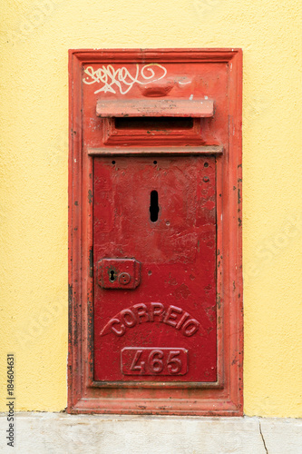 Old rusty mailbox with the word "letters" writen in portugese  "correio"